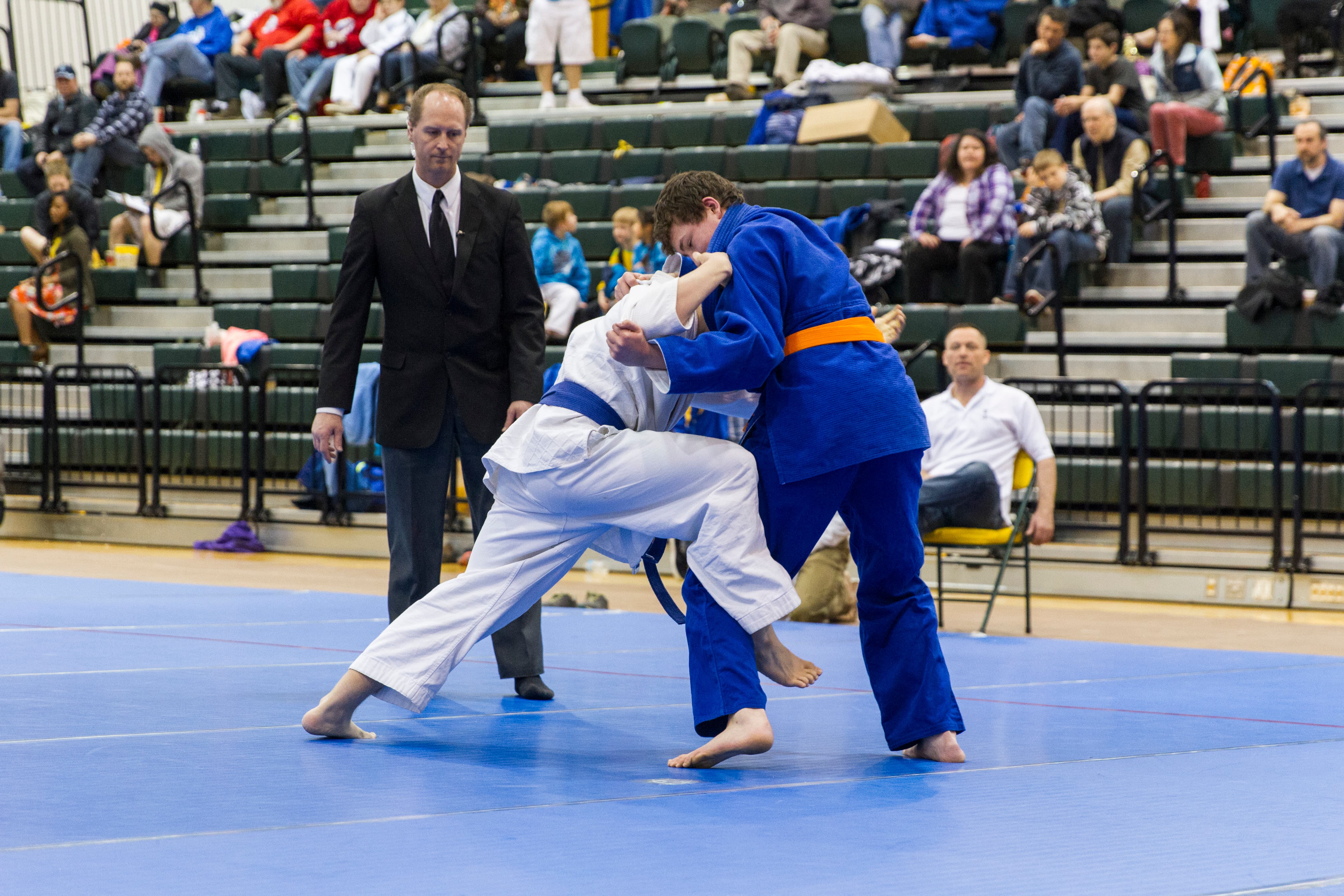 Athletic performance captured at peak — form, focus, and determination