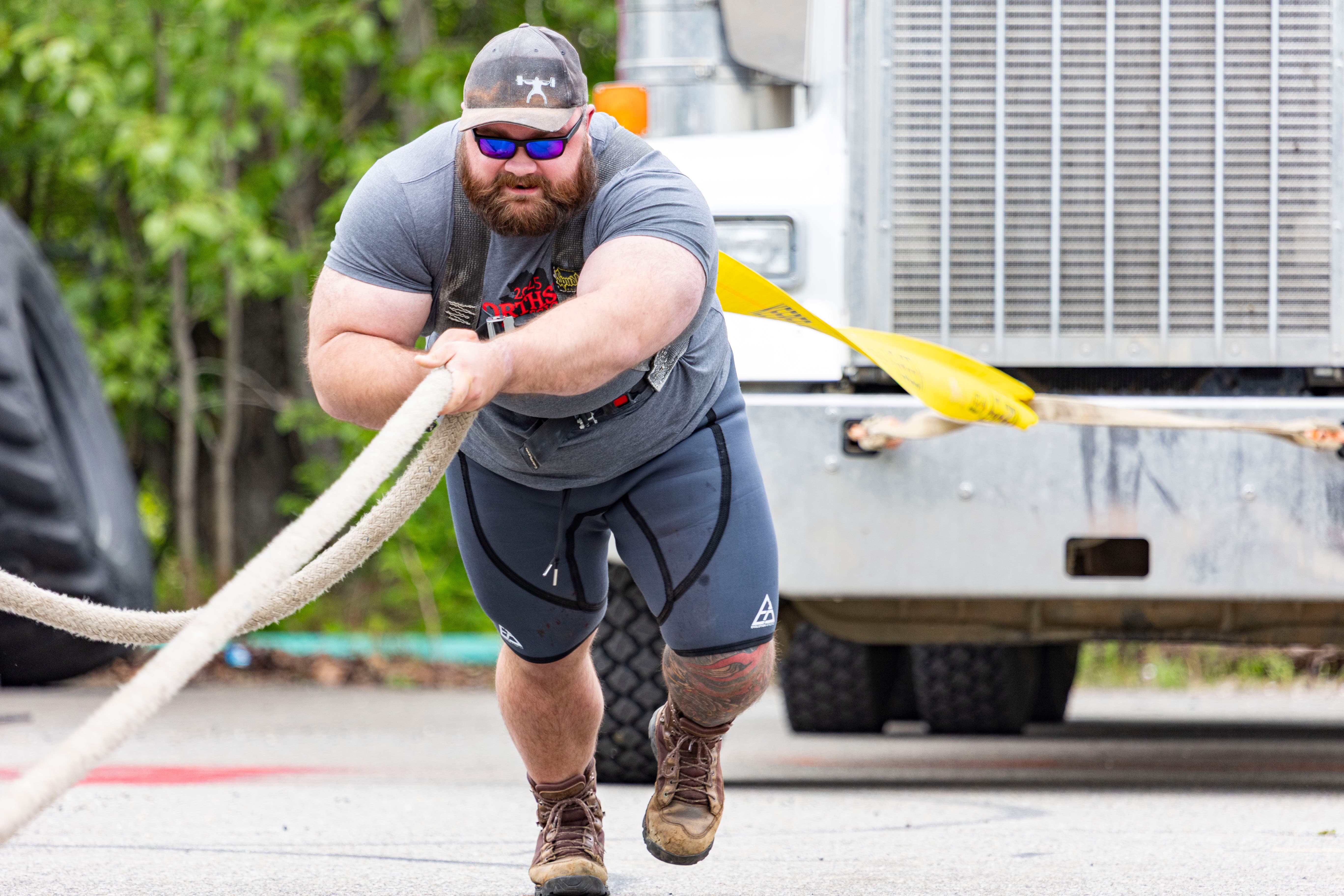Northside Athletics sprinter exploding from the starting blocks in a 100m race