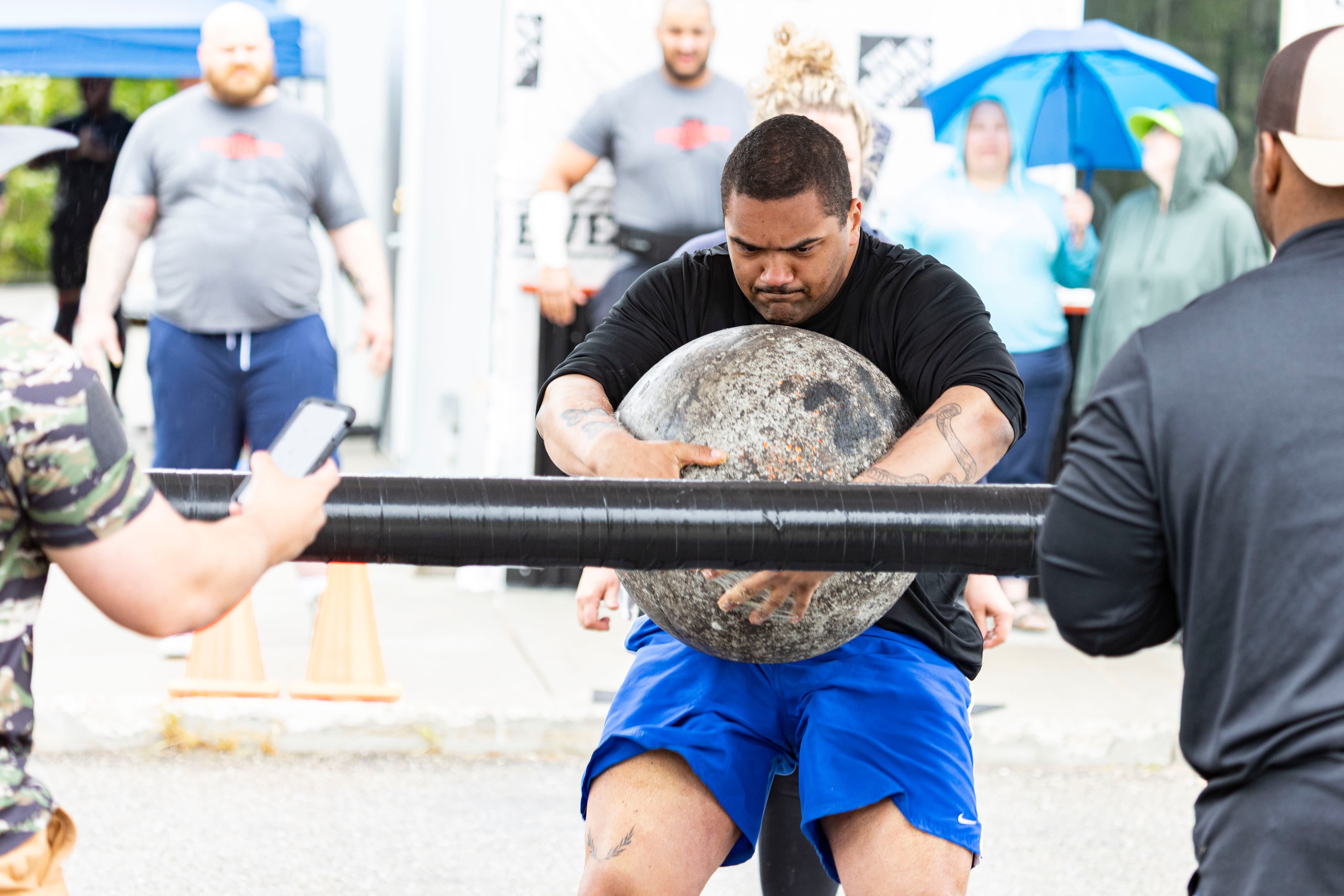 Northside Athletics field event — determination written across the athlete's face