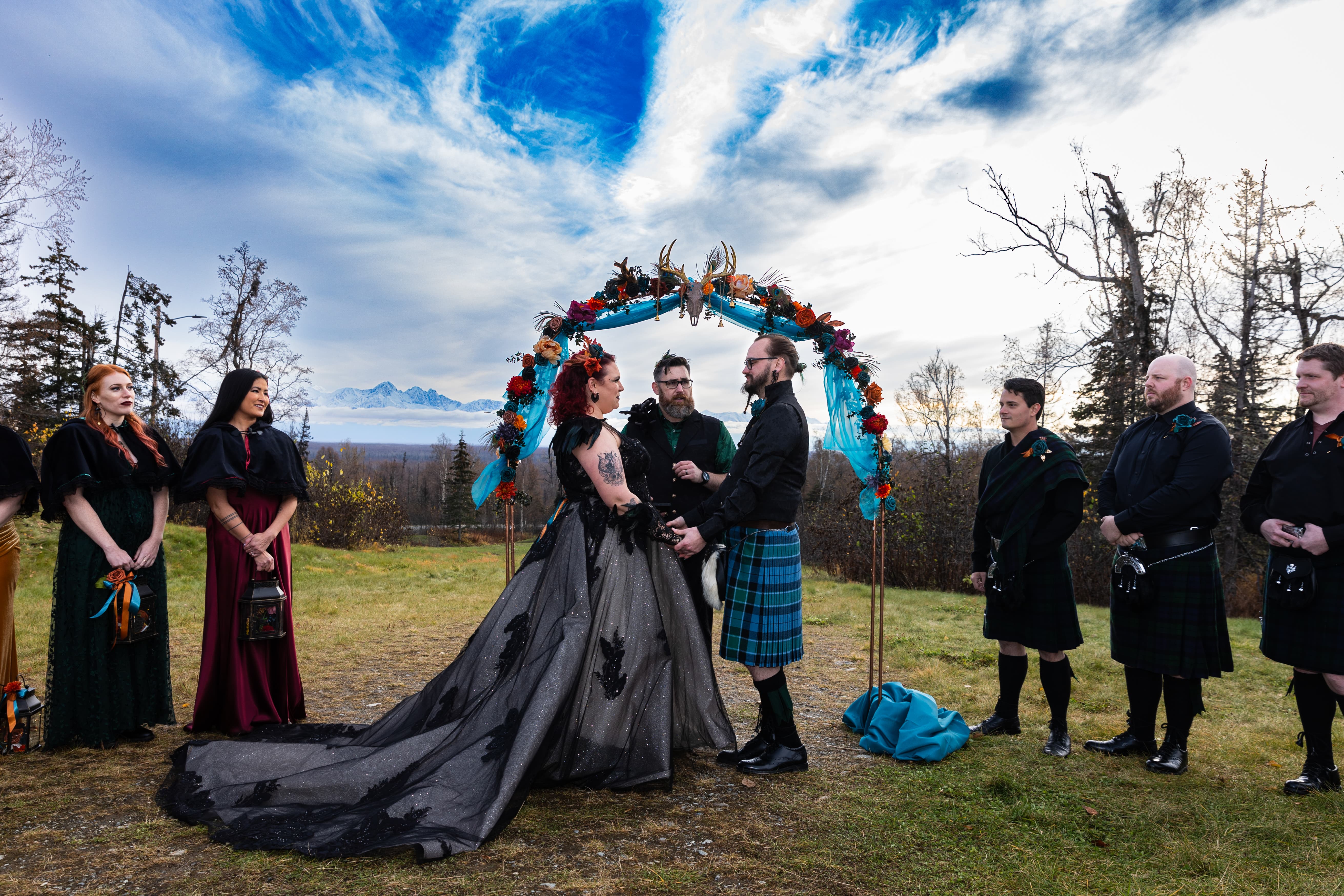 Wedding ceremony — golden light frames the couple as they exchange vows