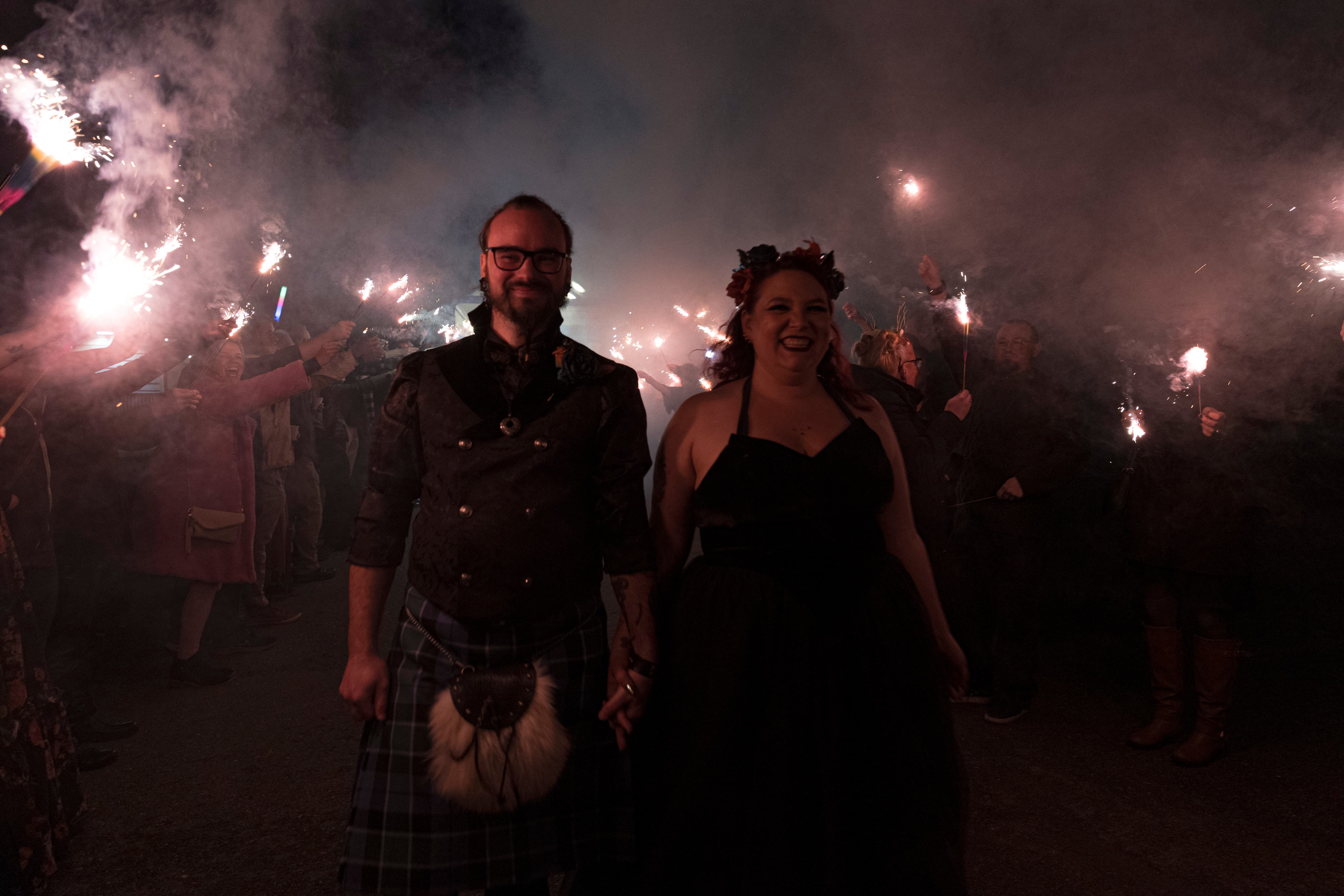 Bride and groom sharing a joyful laugh during post-ceremony portraits