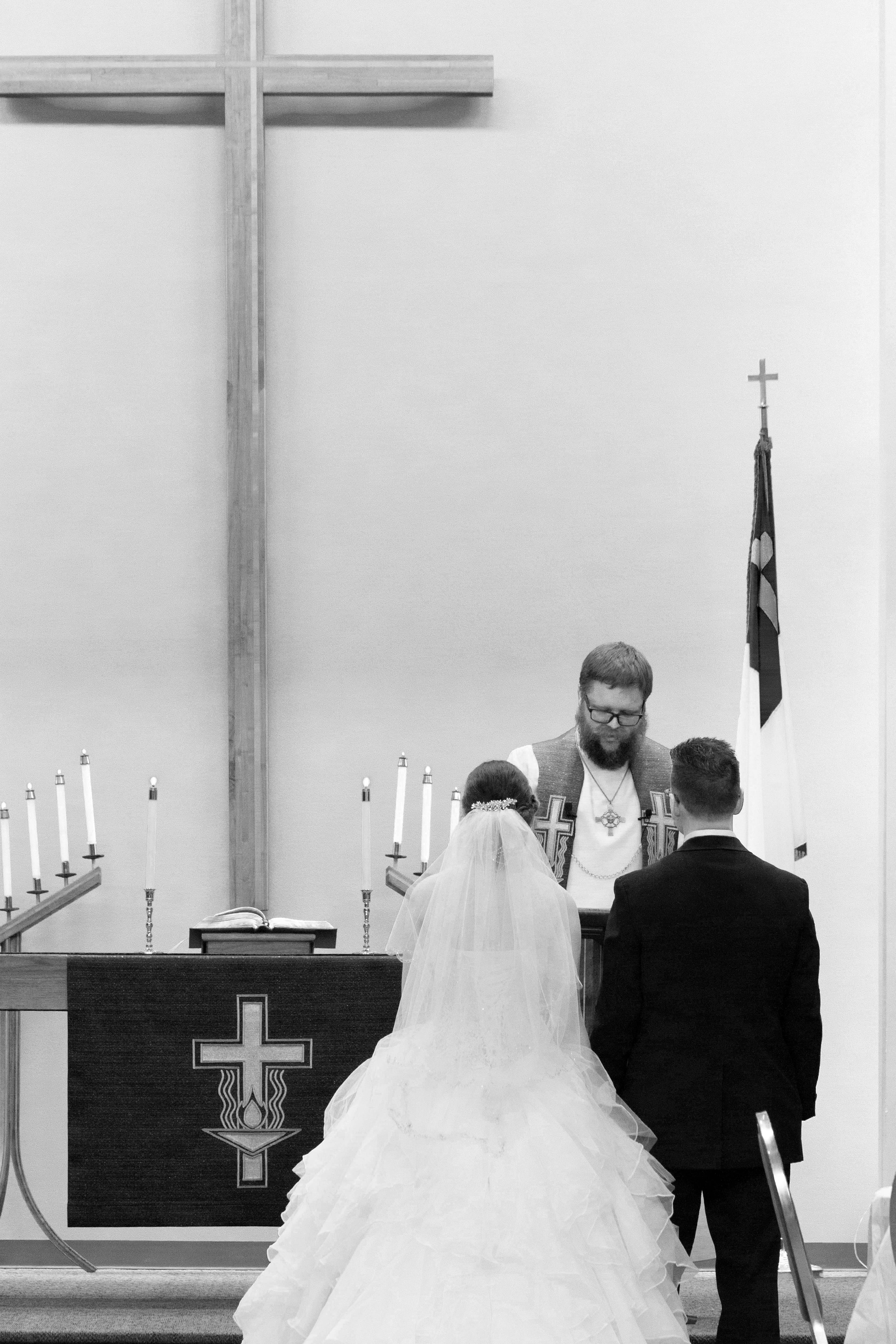 Black and white intimate wedding portrait capturing raw emotion and connection